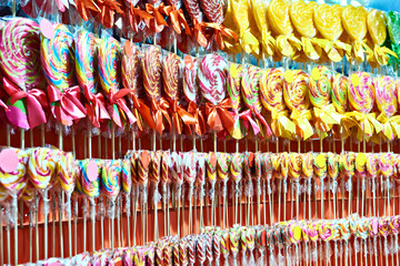 Colored caramel lollipops in shop
