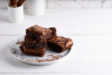 Pieces of brownie cake served on a white table Chocolate cake