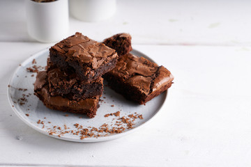 Pieces of brownie cake served on a white table Chocolate cake