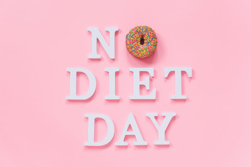 Text No diet day and glazed colorful donut on pink background. Concept International No Diet Day, 6 may Top view Flat lay Template for design, greeting card, invitation