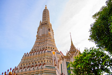 Wat Arun Ratchawararam in the morning sky is a beautiful ancient temple built in the Ayutthaya it is where both domestic and international tourists are popular in Bangkok Thailand