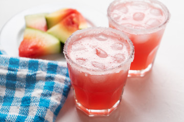 Mexican watermelon margarita cocktail on white background