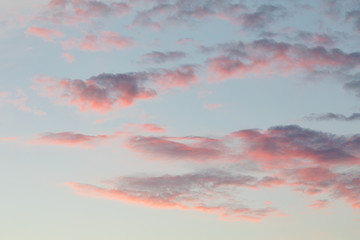 Naklejka na ściany i meble Calm pink clouds sky cloudscape at dusk