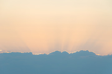 Cloud edge and sunset light behind clouds