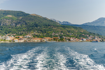 Fototapeta premium Beautiful Mediterranean landscape, mountains, Bay of Kotor and Adriatic sea near Herceg Novi, Montenegro. Sunny summer day near Tivat town. View from the sea.