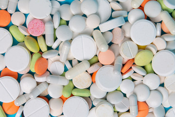 colored medical pills and antibiotics close up top view