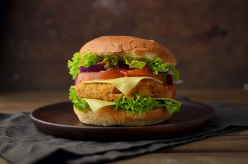 Chicken burger with vegetables and cheese
