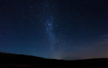 Fototapeta na wymiar Starry night in full darkness, with lactea pathway lighting up the sky