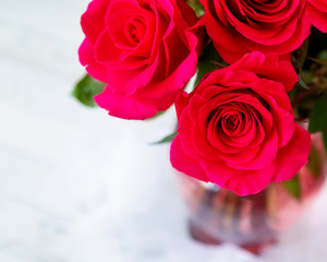 Bouquet of roses in a vase with copy space.