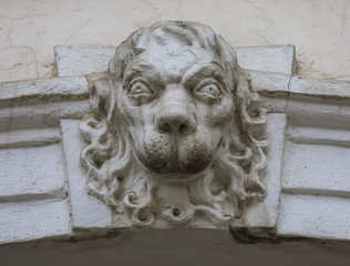 Lion head in bas relief carving