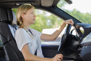 Obraz premium picture of young woman driving