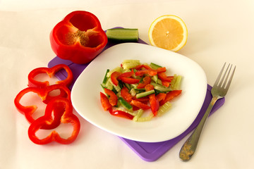 Useful lunch. Vegetable salad on a white plate.