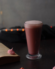 Pink latte in a glass cup