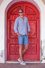 young man fashion photoshoot at the beach sunny day