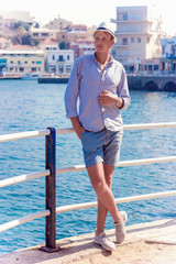 young man fashion photoshoot at the beach sunny day