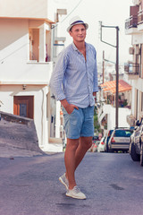 young man fashion photoshoot at the beach sunny day