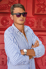 young man fashion photoshoot at the beach sunny day