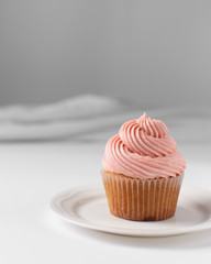 Vanilla cupcake with pink buttercream