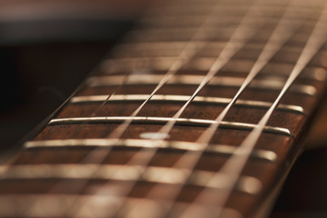 Macro photo of a guitar strings in perspective. Parts of the guitar for good sound and melody....