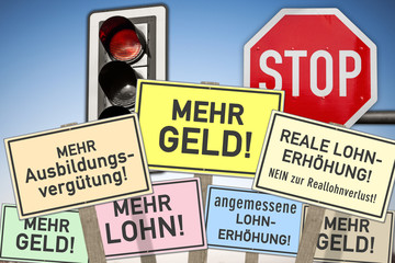 Schilder mit Devisen, Tarifstreit, Tarifverhandlung,