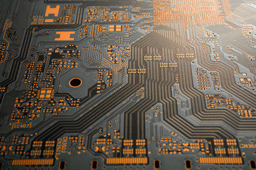 A close-up of black blank Printed circuit board (PCB) with no component mounted (copper exposed)