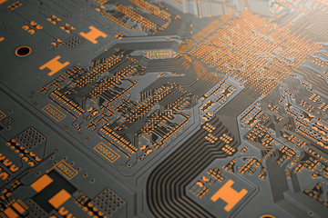 A close-up of black blank Printed circuit board (PCB) with no component mounted (copper exposed)