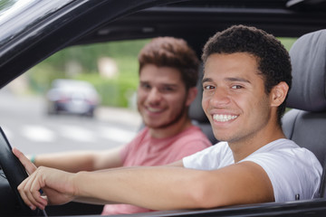 Fototapeta na wymiar portrait of two young men in a car