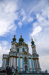 Fototapeta na wymiar Travel to Ukraine - building of St Andrew`s Church in Kyiv city under cloudy sky