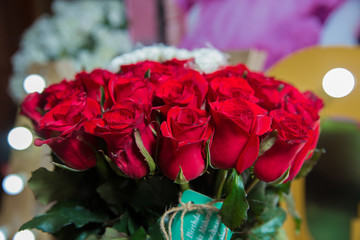 Rose light background. Roses flower texture. Red rose. Bouquet of red roses. copyspace . The letter A is written with white flowers. Beautiful rose flower in garden.
