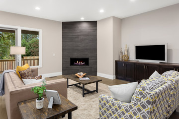 Living room new new home with floor to ceiling fireplace and hardwood floors