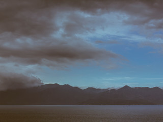 Fototapeta na wymiar Mountains storm clouds and sea