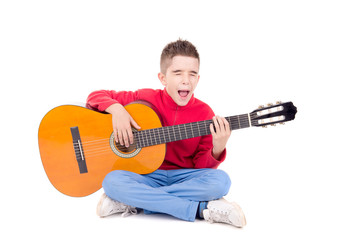 Obraz premium little boy with guitar