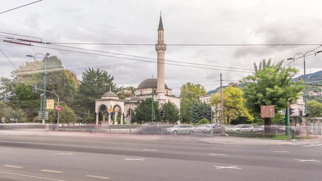 Ali Pasha Mosque timelapse hyperlapse with traffic on intersection, It was completed in 1561 after plans of Hadim Ali Pasha, Sarajevo, Bosnia and Herzegovina.