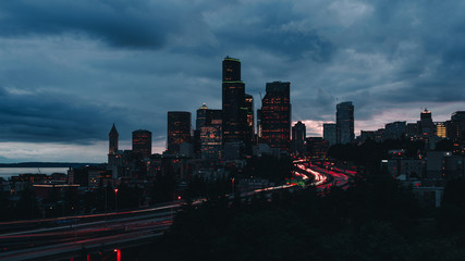 city skyline at night with traffic