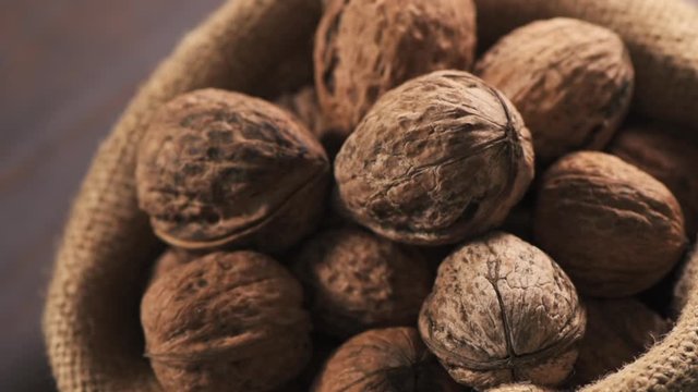 Pile of walnut in burlap sack