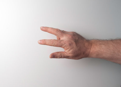 the right and left hand of a person trying to reach or grab something. throw, touch sign. I reach out to the left. isolated on a white background