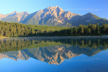 Beautiful reflection af a canadian mountain in the lake , Jasper national park, Canada