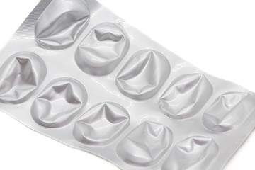 Close up of empty pill aluminum package on white background