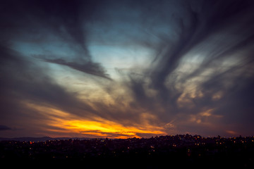 Spectacular sunset with wispy dark clouds