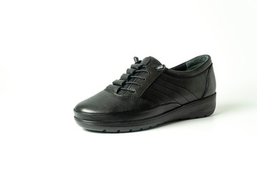 women's heeled shoes, flat sole sports shoes, patent leather shoes on a white background