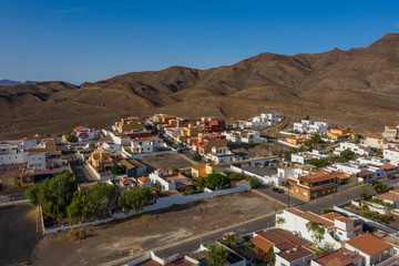 Fototapeta na wymiar Fuerteventura holidays - scenic coastal village Gran Tarajal, Canary islands. Aerial drone view in october 2019