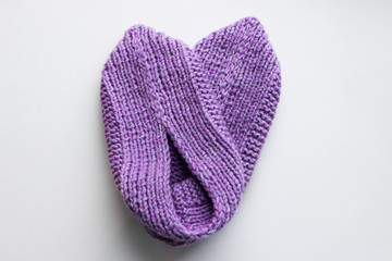 Handmade knitted pink slippers on white background