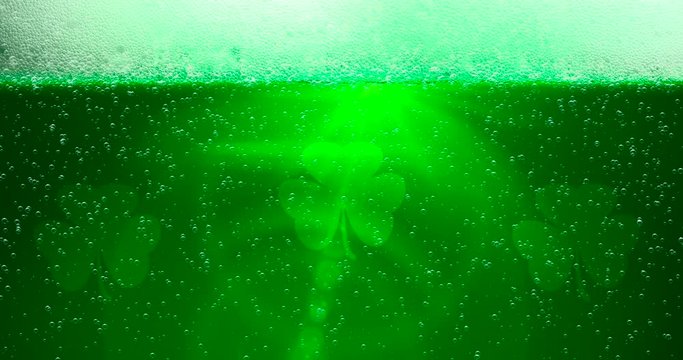 St. Patrick's Day Green Beer background with lens flare with shamrock leafs. For festive pub party event. 3d render, loop 4k