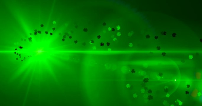 St. Patrick's Day background with green leaves and lens flare. loop 4k