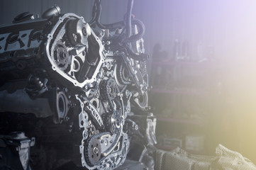 New car timing kit on removed engine in workshop