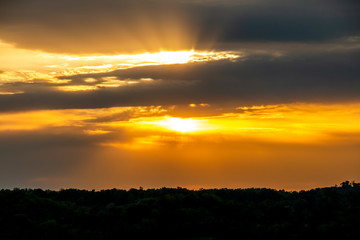 Fototapeta premium Orange sunset over a mountain range