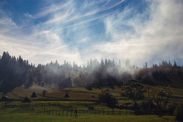 Mountain landscape with smoke on a beautiful sunny day