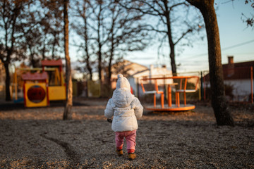 little girl in autumn park