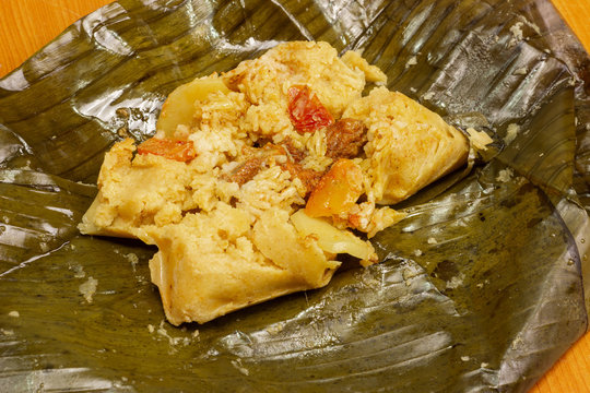 Nacatamal typical Nicaraguan food, corn, meat, butter, potatoes, onion, wrapped banana leaf