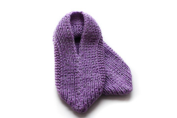 Handmade knitted pink slippers. On white background you can easily place text or change the background